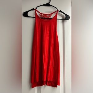 Charlotte Russe open side flowy tank in an orangey/red color!